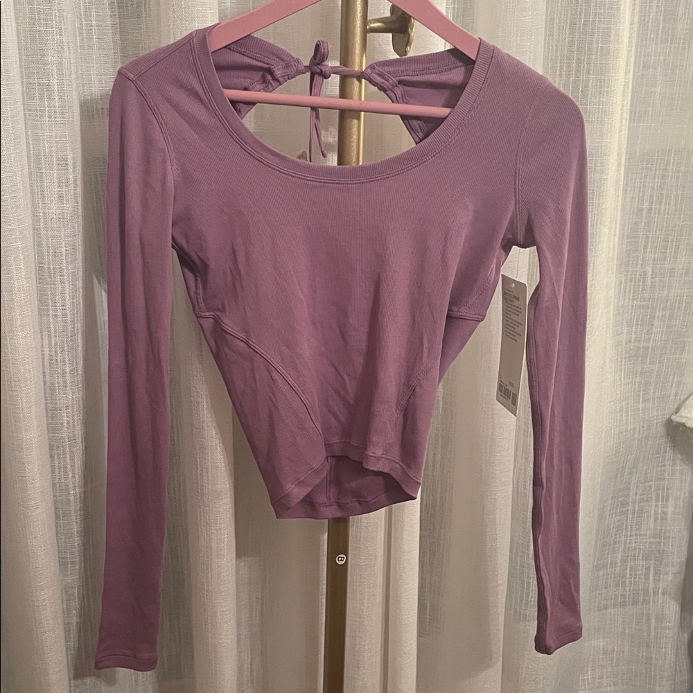 Lululemon Athletica Open Back Ribbed Lavender Long Sleeve
New with Tags Size 2